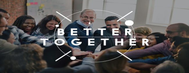 Image of group of people smiling putting their hands together with the words "better together" over them.