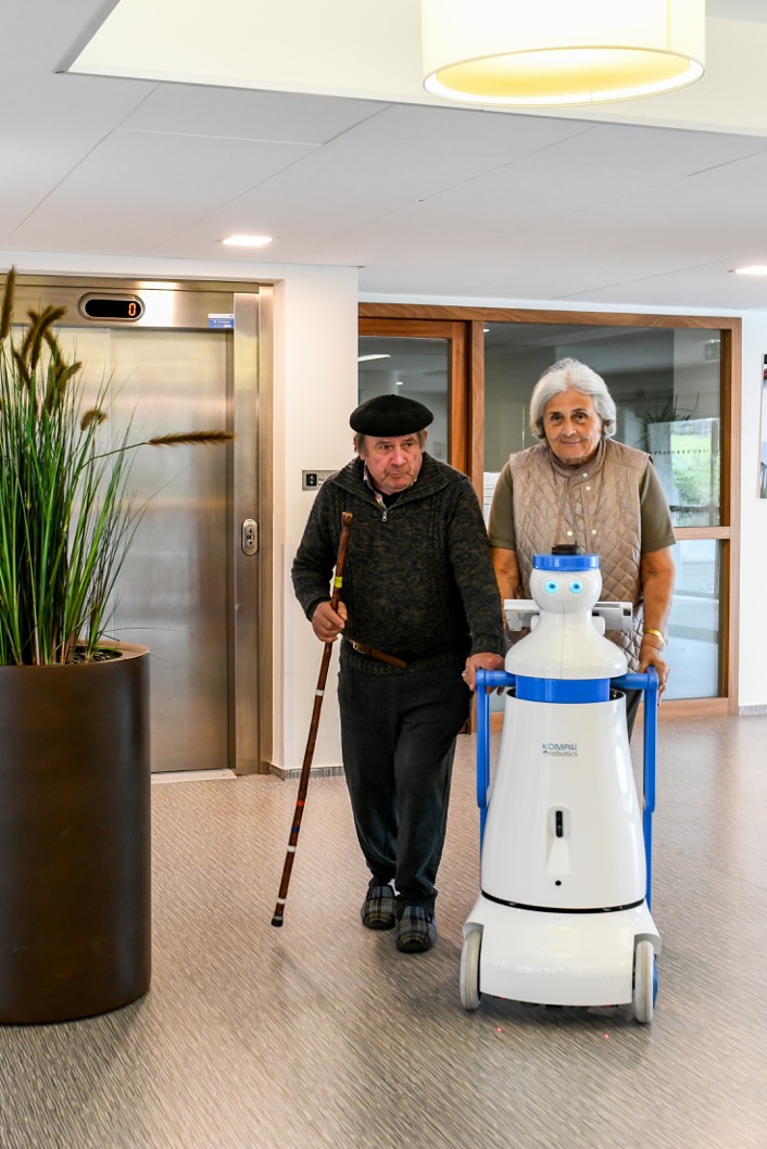 KOMPAÏ robot assisting older persons during a walk in nursing home