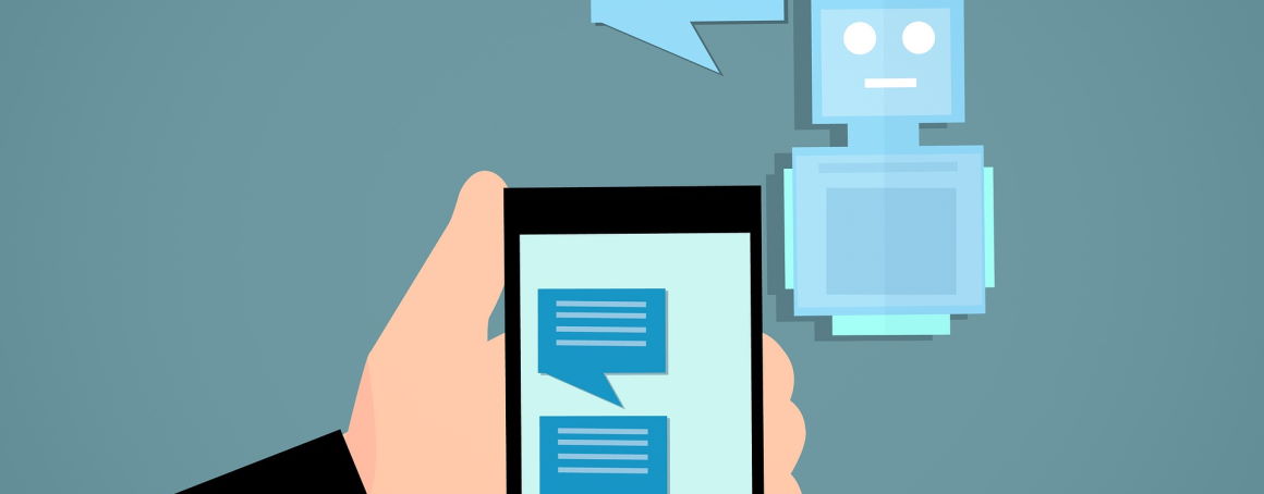 Image of a chatbot speaking and relaying that message to a phone in a persons hand. The phone displays the full conversation between phone and bot.