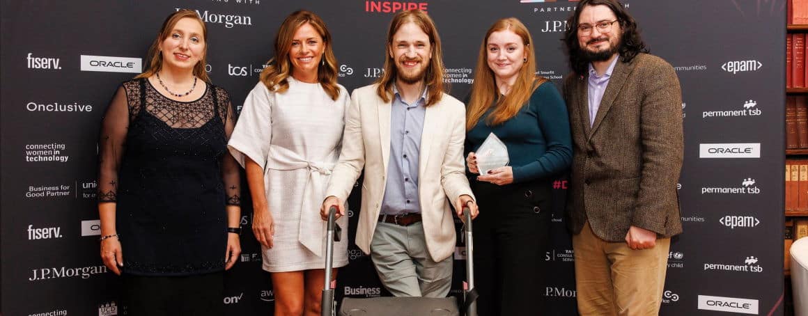 Access Earth Team at the diversity in tech awards. Amy is holding a crystal trophy while standing between Matt and Donal