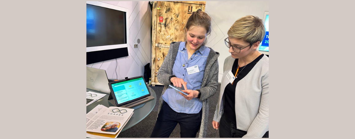 Gewi demonstrating the digital solution eCare as developed within the Pilot Theme 2 of the SHAPES project to an interested participant